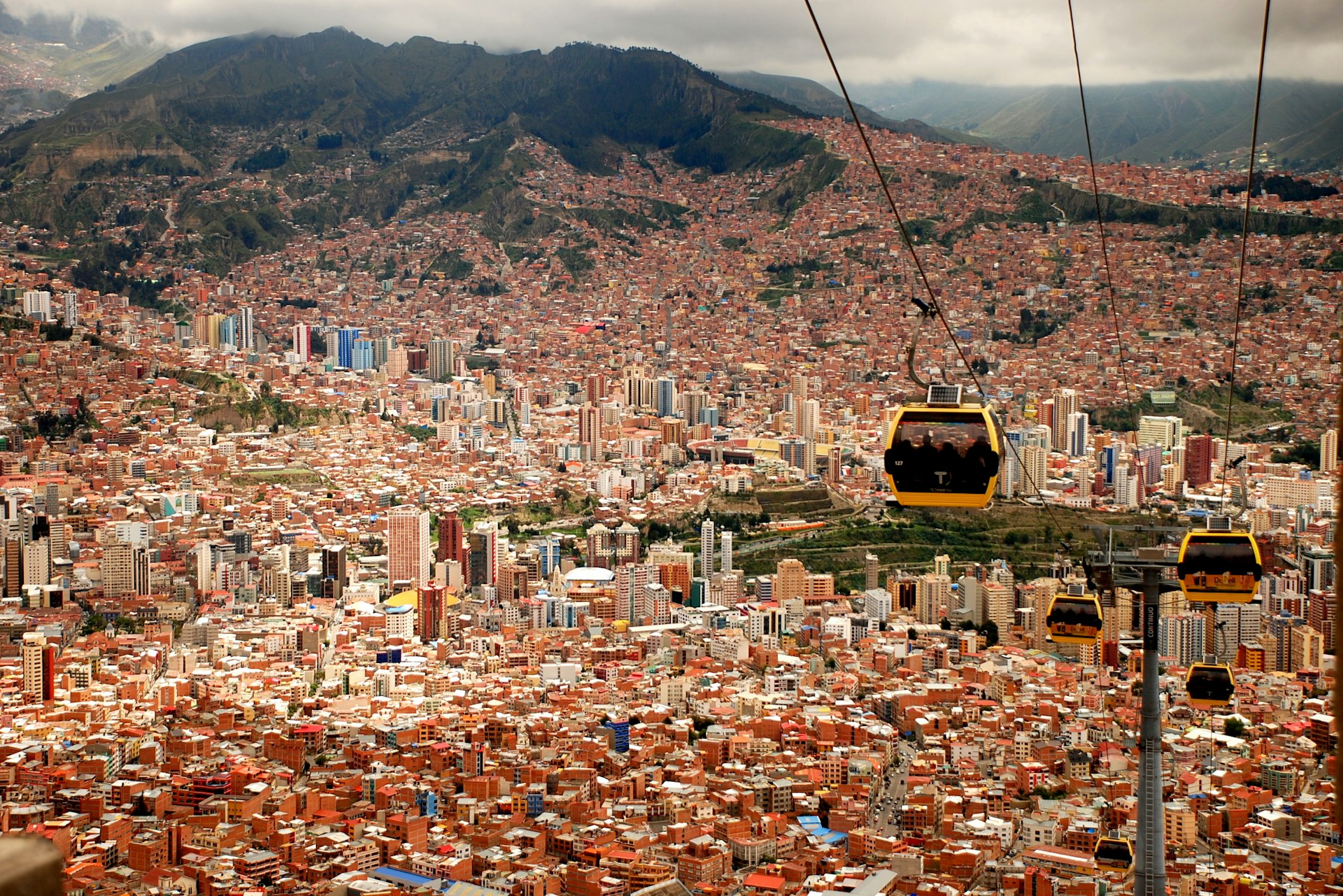 View of the city of La Paz, Bolivia, with high-rise residential buildings and mountains in the background